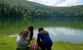View of Saint Anna Lake Romania, surrounded by dense pine forests